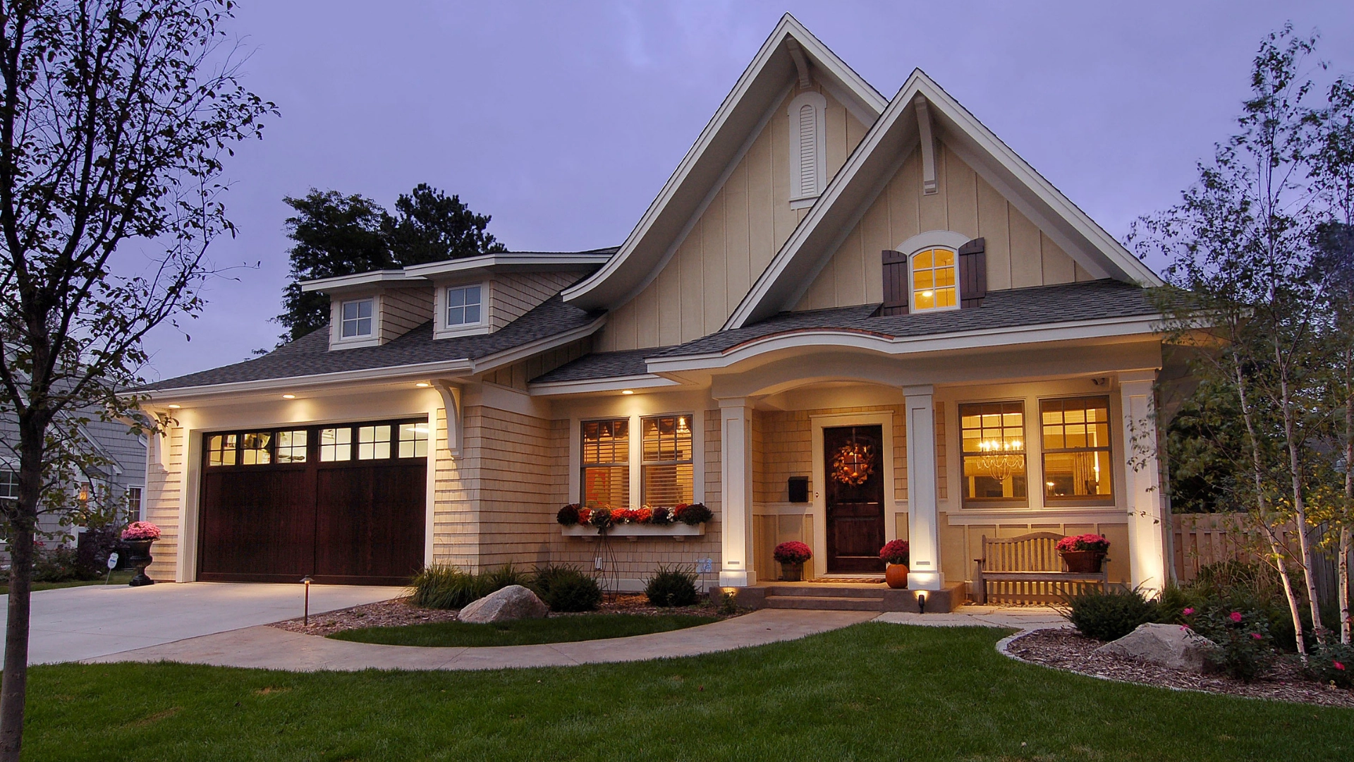 Craftsman-style home illuminated at dusk