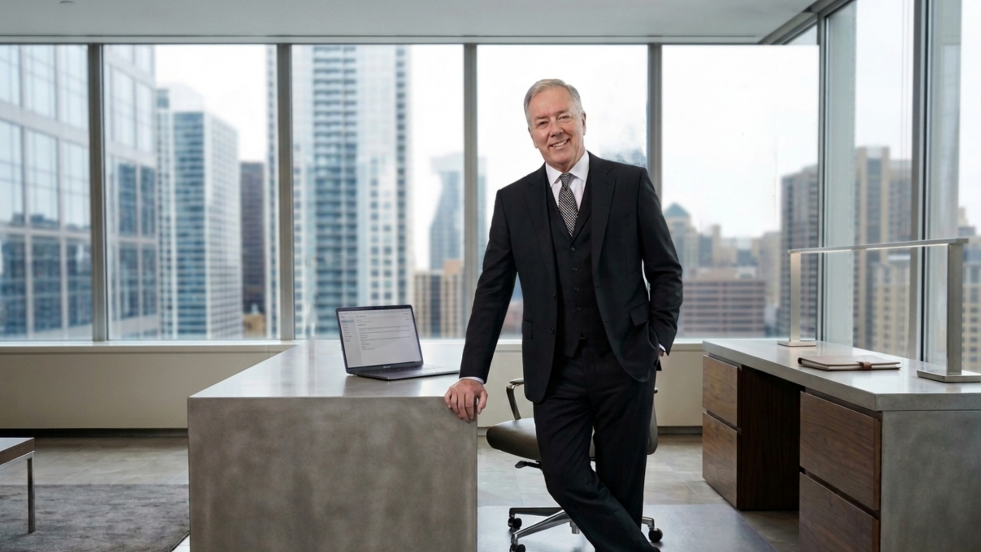 David in a modern office with city skyline views