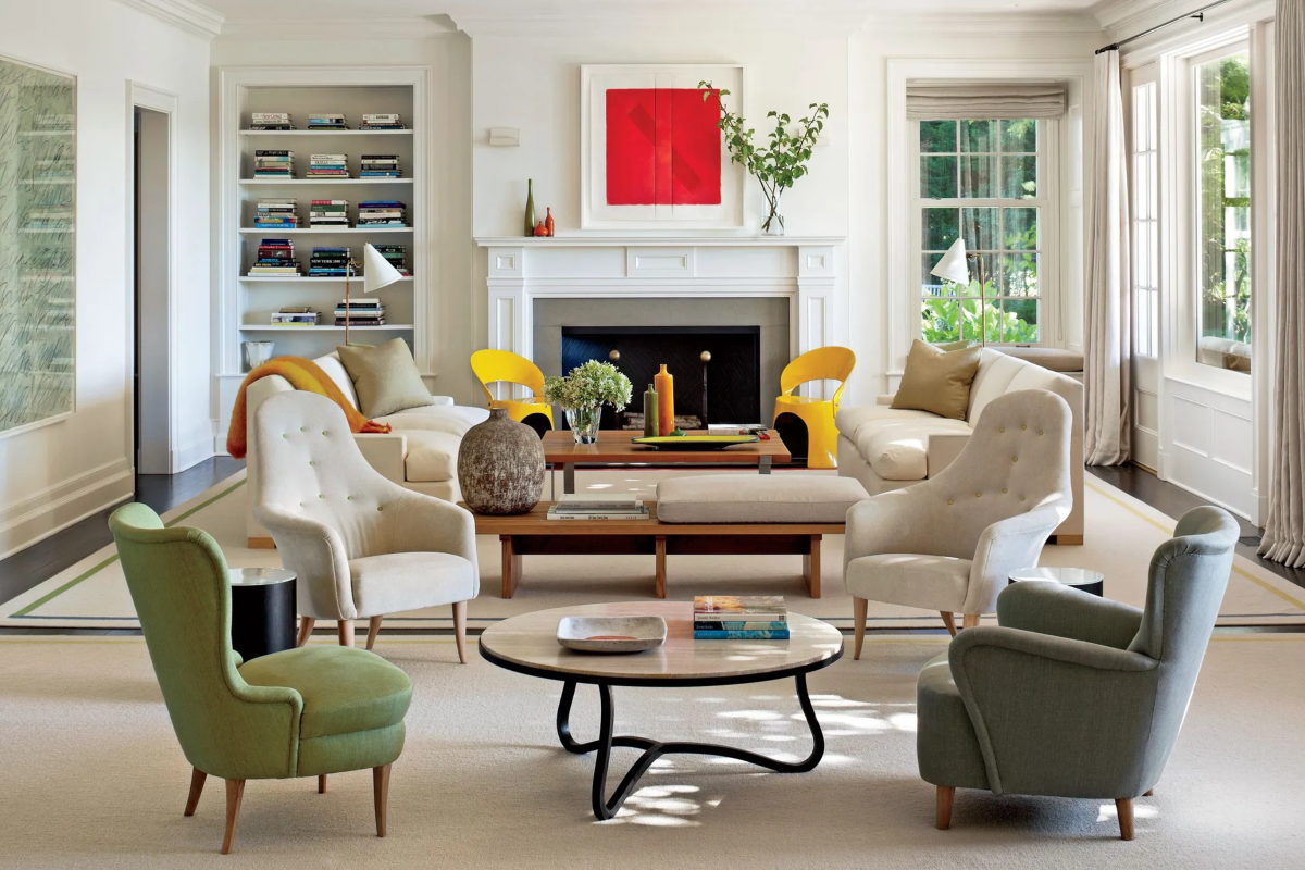 Bright classic living room with mid-century chairs and modern art