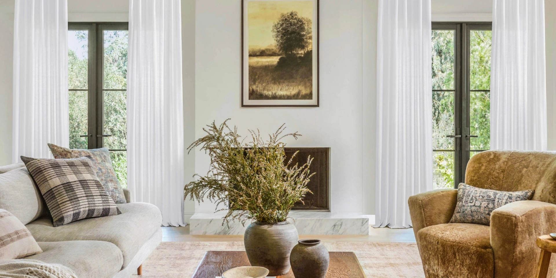 Bright modern living room with tall draped windows